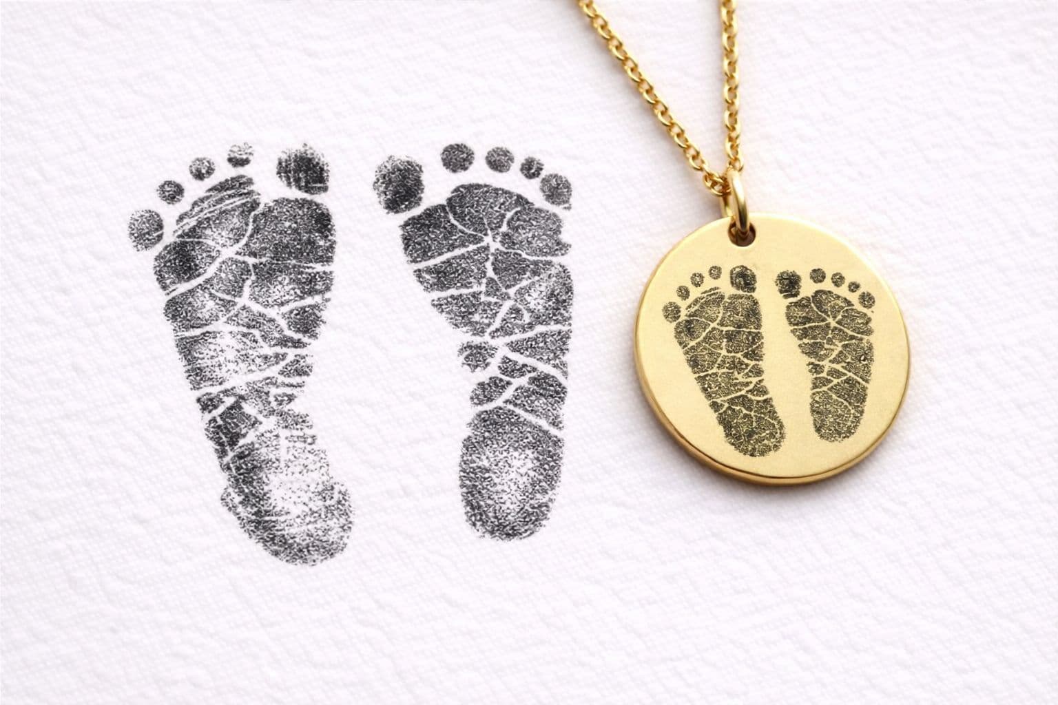 An engraved footprint pendant — example of a personalized keepsake necklace